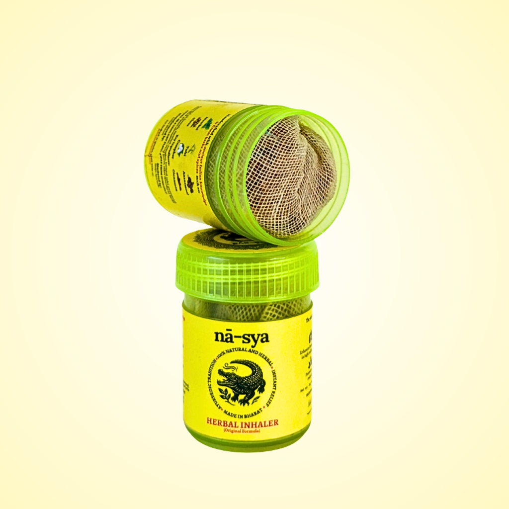 Yellow herbal inhaler with green cap on a light yellow background